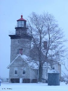 The lighthouse stands as dusk approaches.