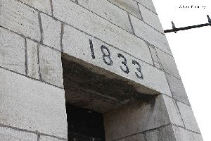 The 1833 engraving over the entrance to the tower.
