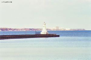 Distance shot of the lighthouse out on the pier.
