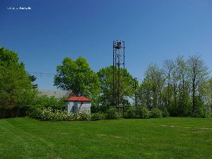 The tower behind the apartment complex.
