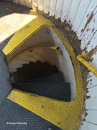 Hatch leading to stairs inside the Fort Niagara Lighthouse.