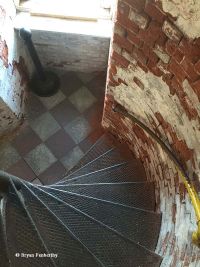 At the base of the steps of the Fort Niagara Lighthouse.