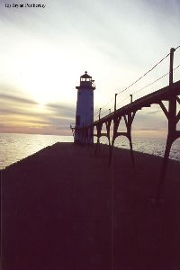 The lighthouse and the pier at dusk.
