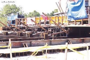 DURING MOVE: The hydraulic jacks that pushed Hatteras along the girders.