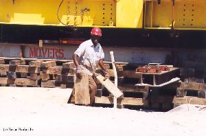 DURING MOVE: A worker helps move the tower.