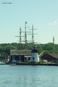 Tall ship masts in the background.