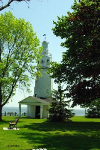 The lighthouse looks over the lake.