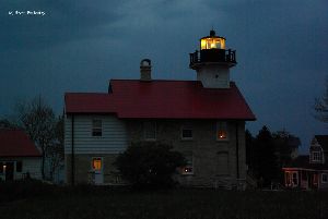 Lighthouse at dusk, light lit.