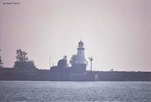 Lighthouse on the wall in marina.